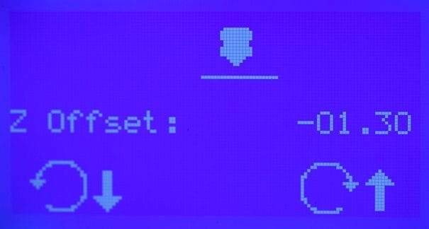 Mastering Z Offset Adjustment for Your 3D Printer 1 Display screen showing a purple background with the text "Z Offset: -01.30" and navigation icons, including an arrow pointing down, circular arrows, and arrows indicating up and down movement.