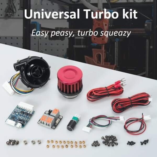 A collection of components for a universal turbo kit, including a black turbocharger, a red air filter, various wires, a circuit board, connectors, screws, and small metallic parts, arranged on a tabletop.