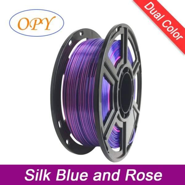 A spool of dual-colour 3D printing filament in silk blue and rose, featuring a black plastic reel with a large centre hole.