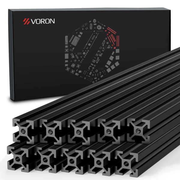 A set of black aluminium extrusions arranged in a stack, with a branded box in the background featuring a geometric pattern and the name "VORON."